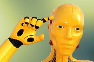 En gul robot peger med en finger op på tindingen.