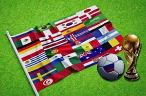 En VM-bold og et flag hvor vi ser alle VM-deltagernes flag.